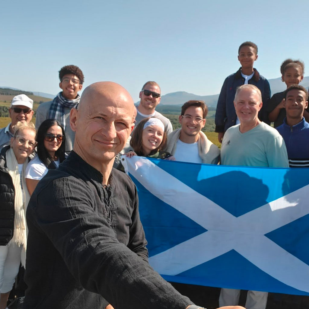 local Edinburgh tour guide with guests on a private tour in Scotland