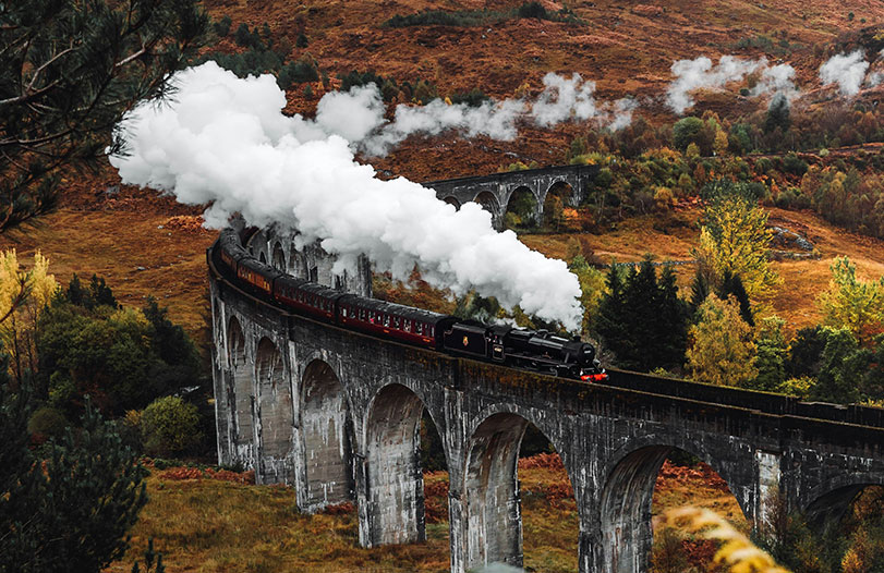 Scotland scenic train crossing a viaduct on a guided tour