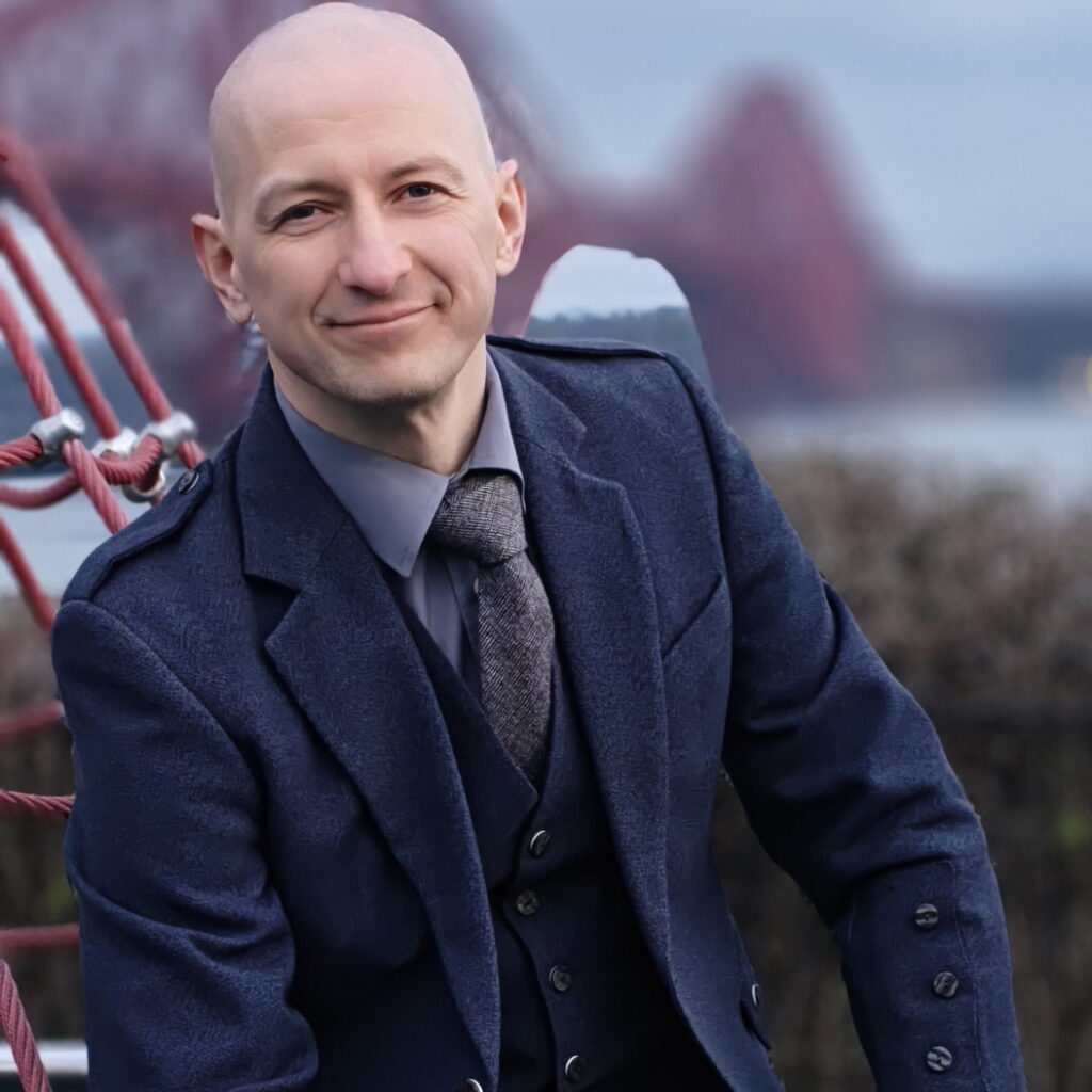 private tour guide in Scotland at a scenic location and iconic bridge